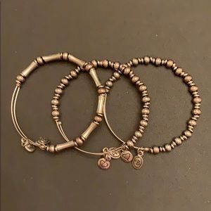 3 Adjustable silver-tone bead bracelets.
